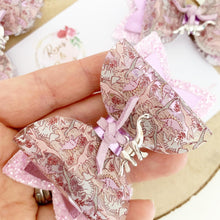 Load image into Gallery viewer, Dinosaurs transparent glitter charm Hair Bow Headband or Clip