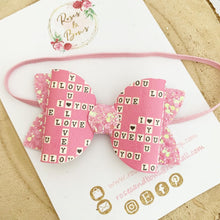 Load image into Gallery viewer, Pink Scrabble Leatherette and Glitter Bow Headband or Clip

