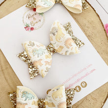 Load image into Gallery viewer, Gold Dinosaur Leatherette and Glitter Bow Headband or Clip
