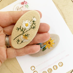 Embroidered flower snap clip set