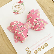 Load image into Gallery viewer, Pink Scrabble Leatherette and Glitter Bow Headband or Clip

