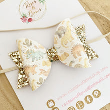 Load image into Gallery viewer, Gold Dinosaur Leatherette and Glitter Bow Headband or Clip
